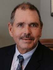 J Rudi Trader headshot