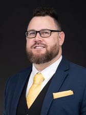 Jonathan Eric May headshot